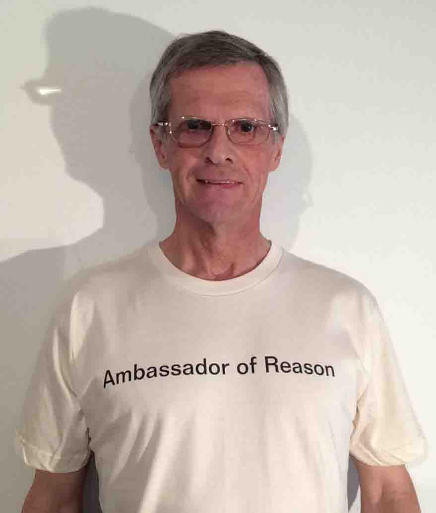Darwin Bedford wearing his shirt that says 'Ambassasdor of Reason'