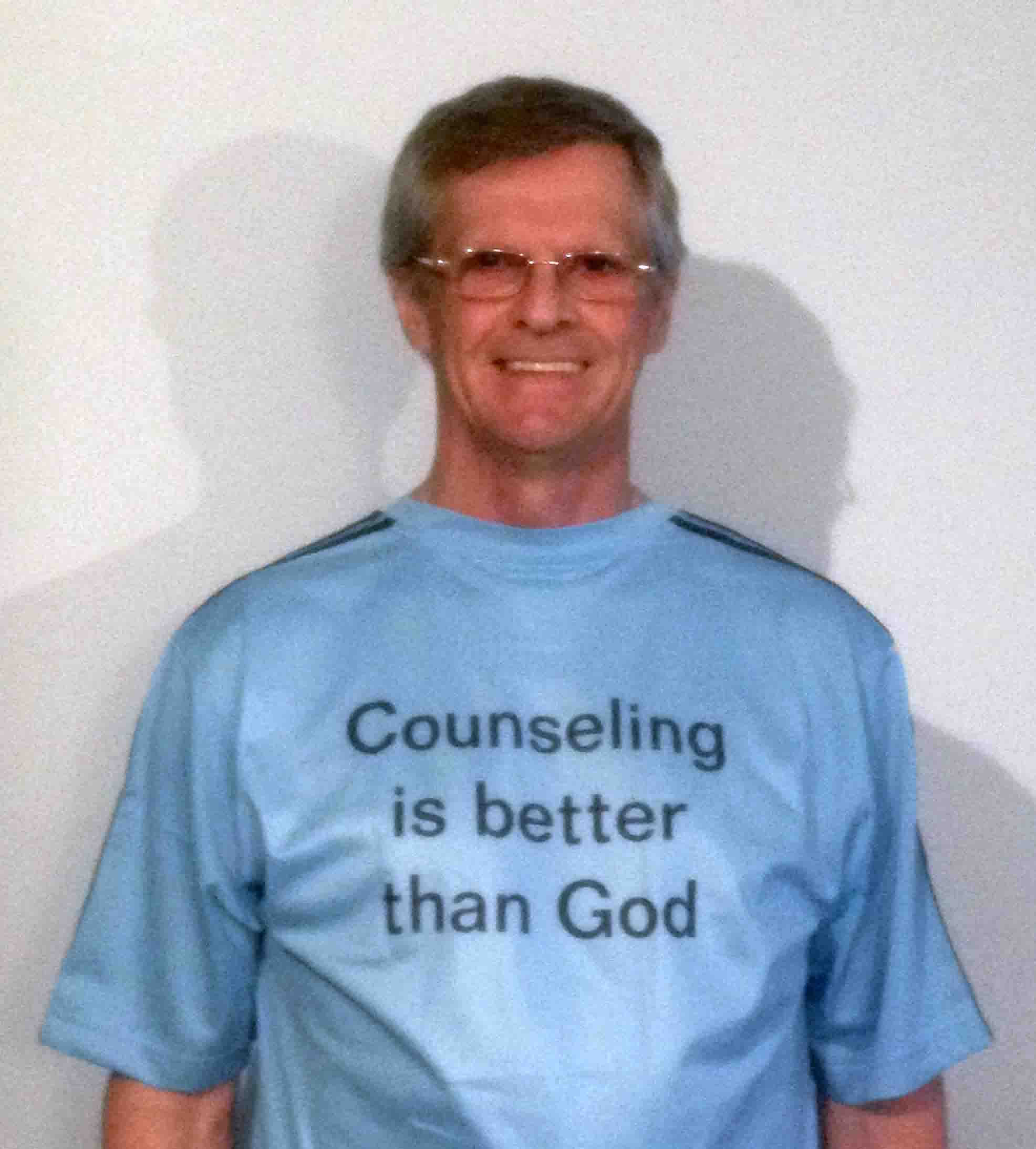 Darwin Bedford wearing his shirt that says 'Counseling is better than God'