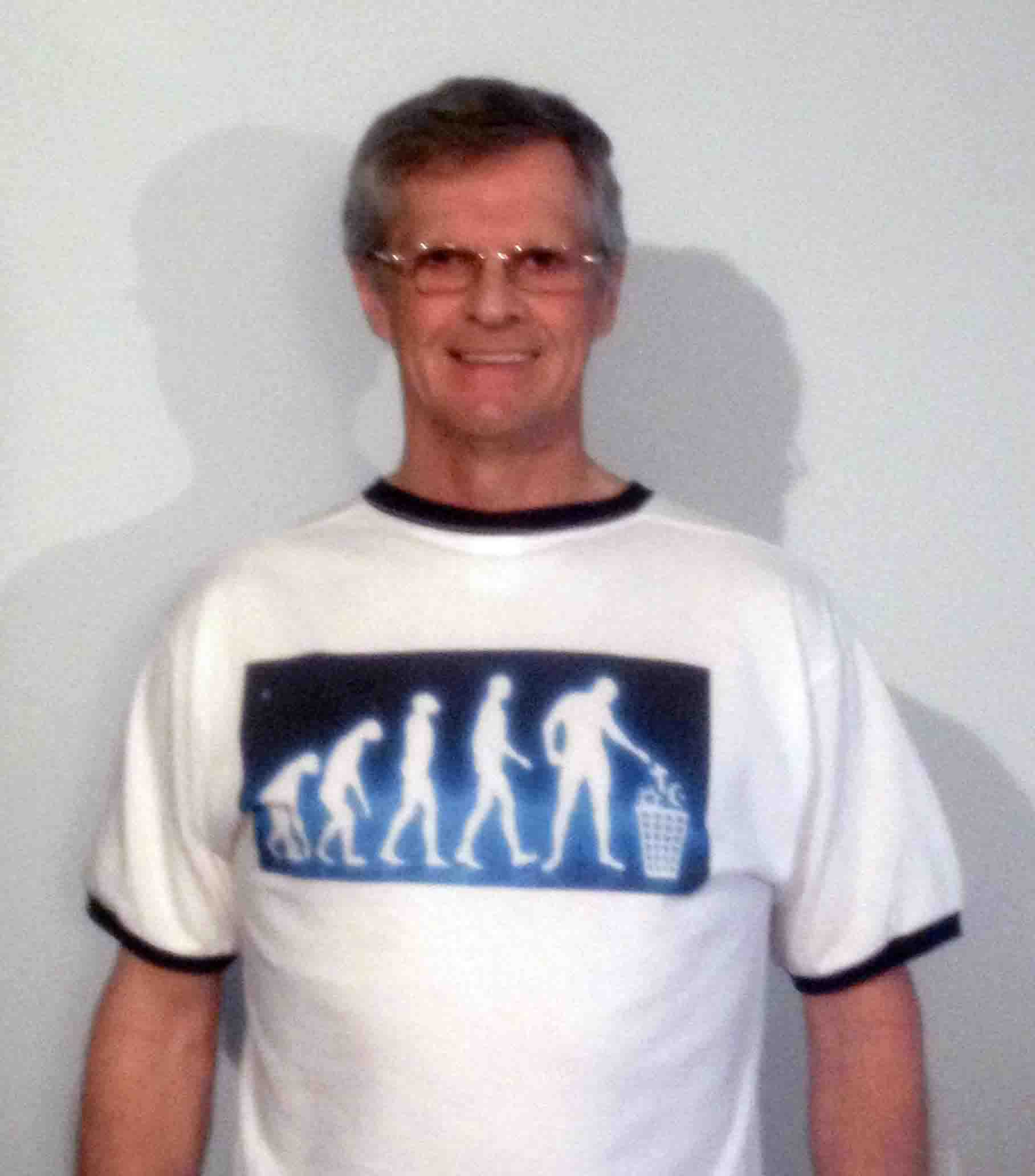 Darwin Bedford wearing his shirt that shows man evolving to the point of trashing religion