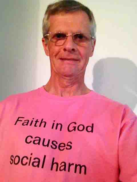 Darwin Bedford wearing his shirt that says 'Faith in God causes social harm'