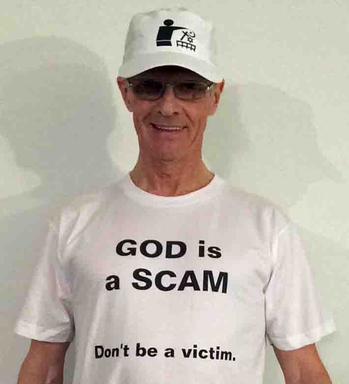 Darwin Bedford wearing his shirt that says 'GOD is a SCAM - Don't be a victim'