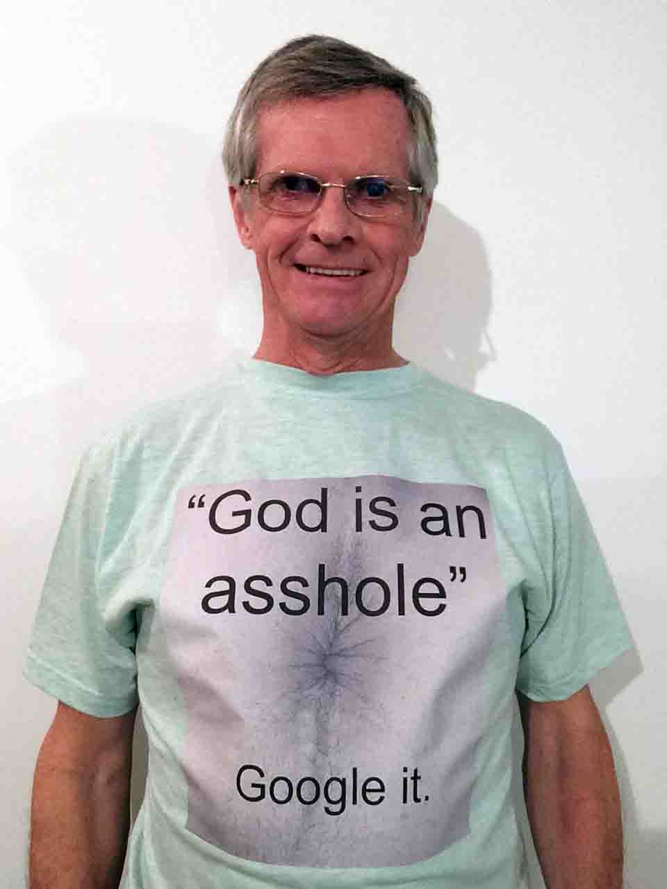 Darwin Bedford wearing his shirt that says 'God is an asshole, Google it.'