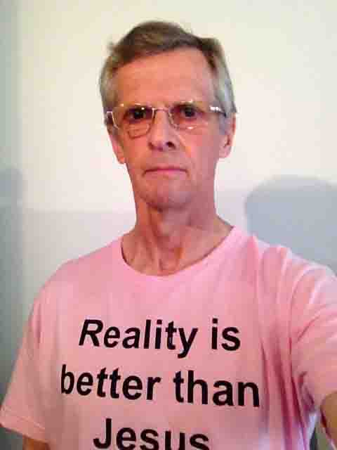 Darwin Bedford wearing his shirt that says 'Reality is better than Jesus'