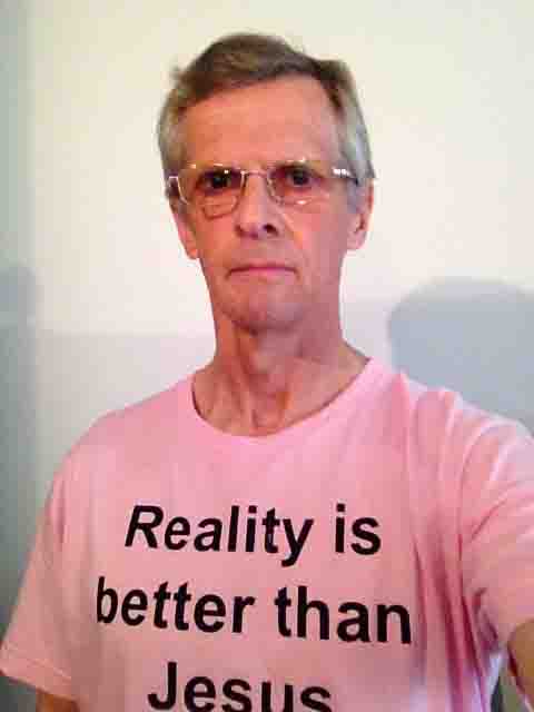 Darwin Bedford wearing his shirt that says 'Reality is better than Jesus'