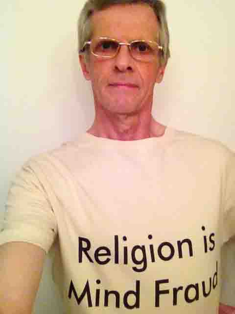 Darwin Bedford wearing his shirt that says 'Religion is mind fraud'