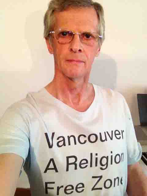 Darwin Bedford wearing his shirt that says 'Vancouver, a religion-free zone'