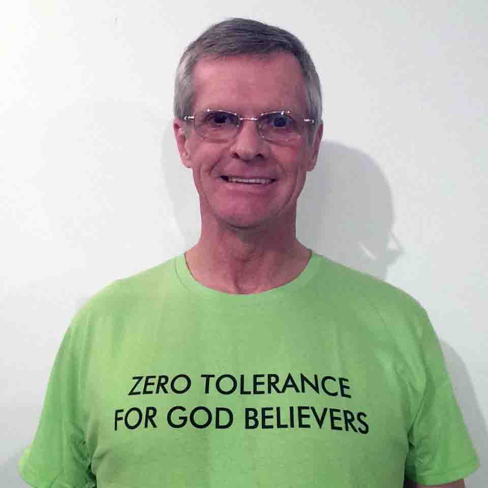 Darwin Bedford wearing his shirt that says 'Zero tolerance for God believers'