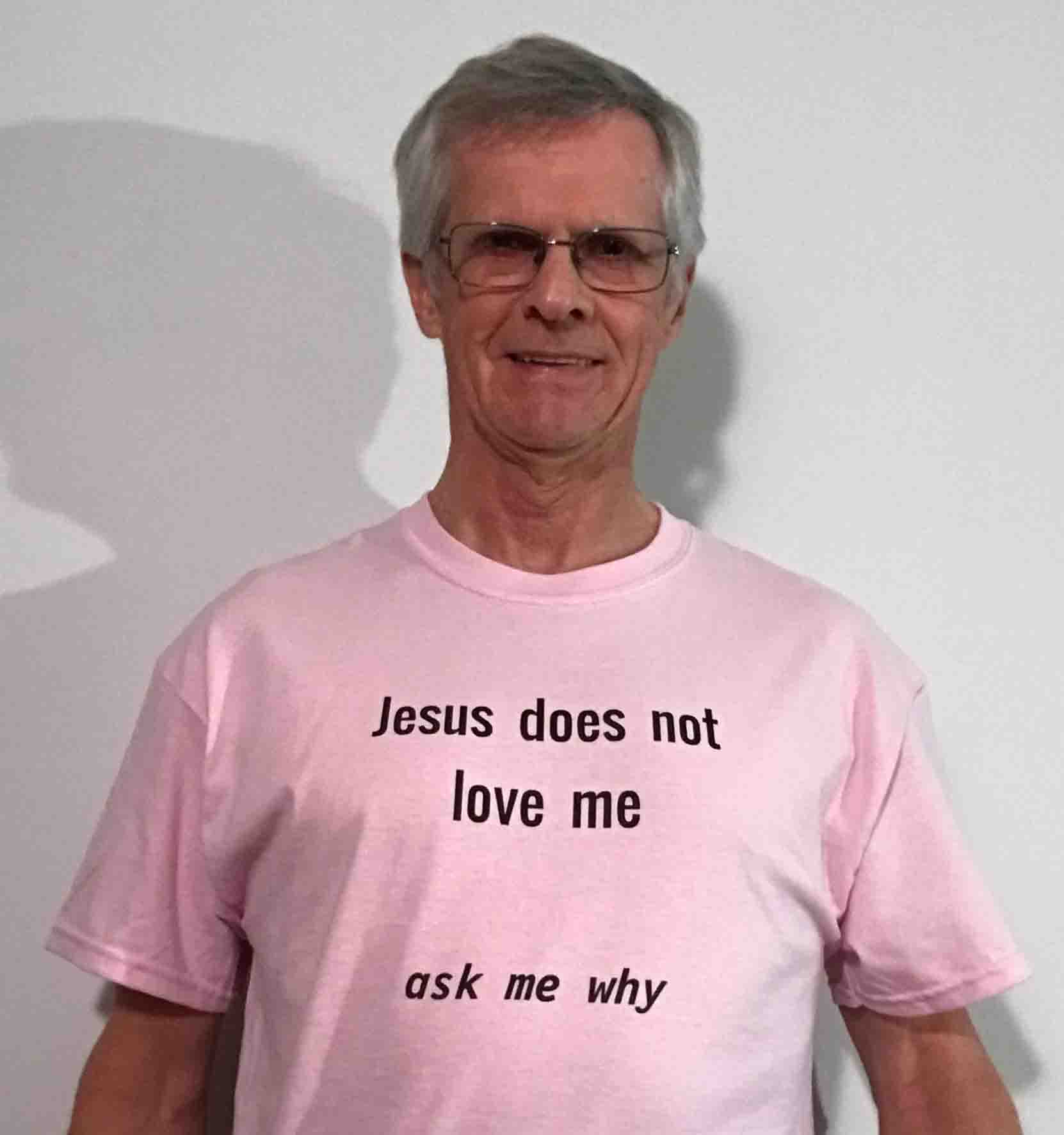 Darwin Bedford wearing his shirt that says 'Jesus does not love me, ask me why'