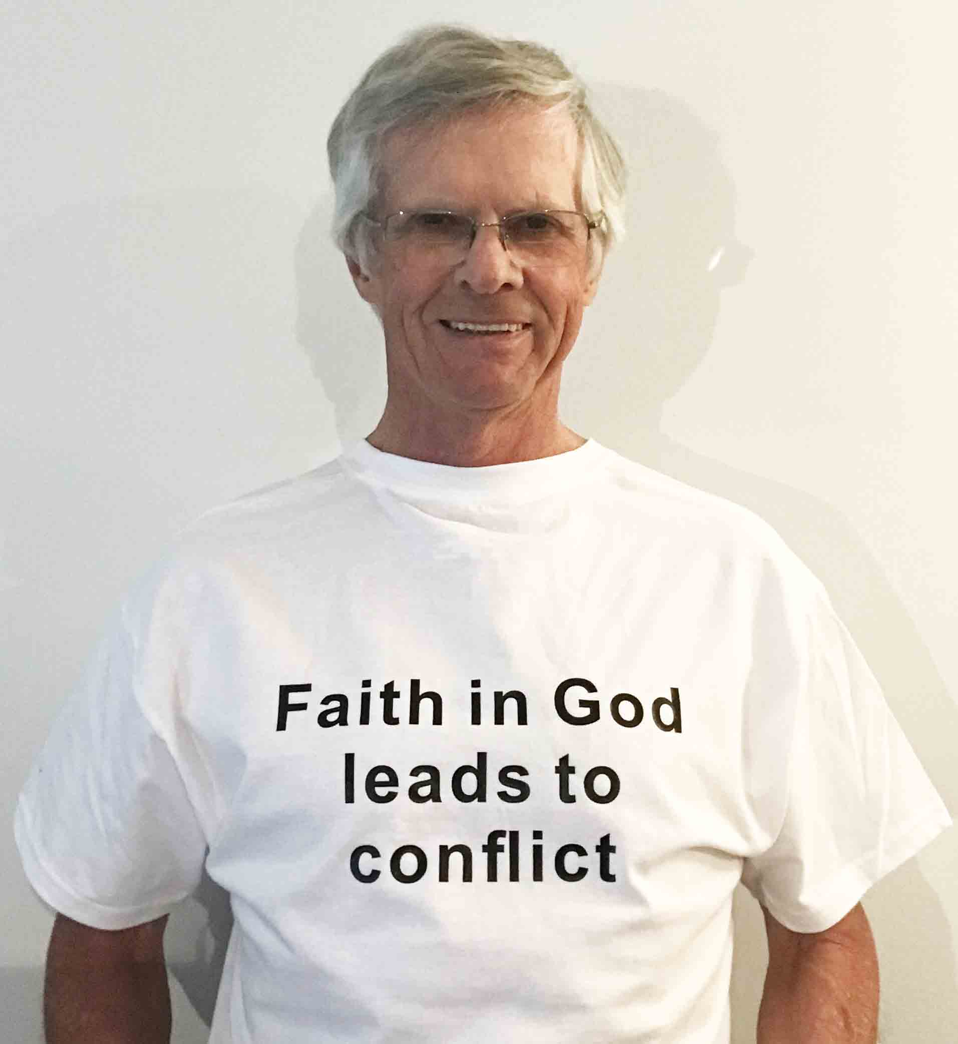 Darwin Bedford wearing his shirt that says 'Faith in God leads to conflict'