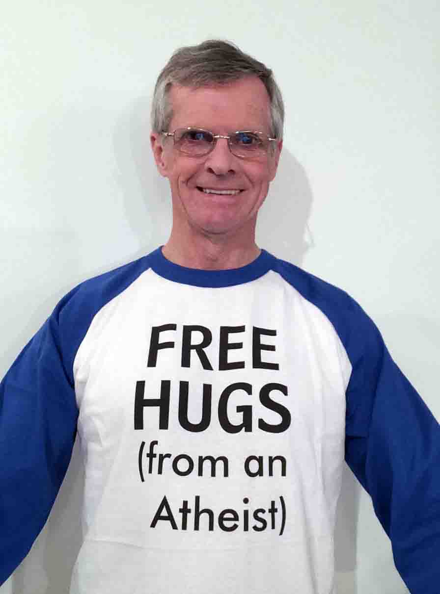 Darwin Bedford wearing his shirt that says 'FREE HUGS from an atheist'