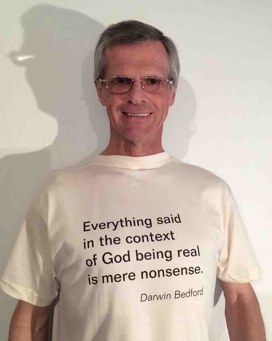 Darwin Bedford wearing his shirt that says 'Everything said in the context of God being real is mere nonsense'