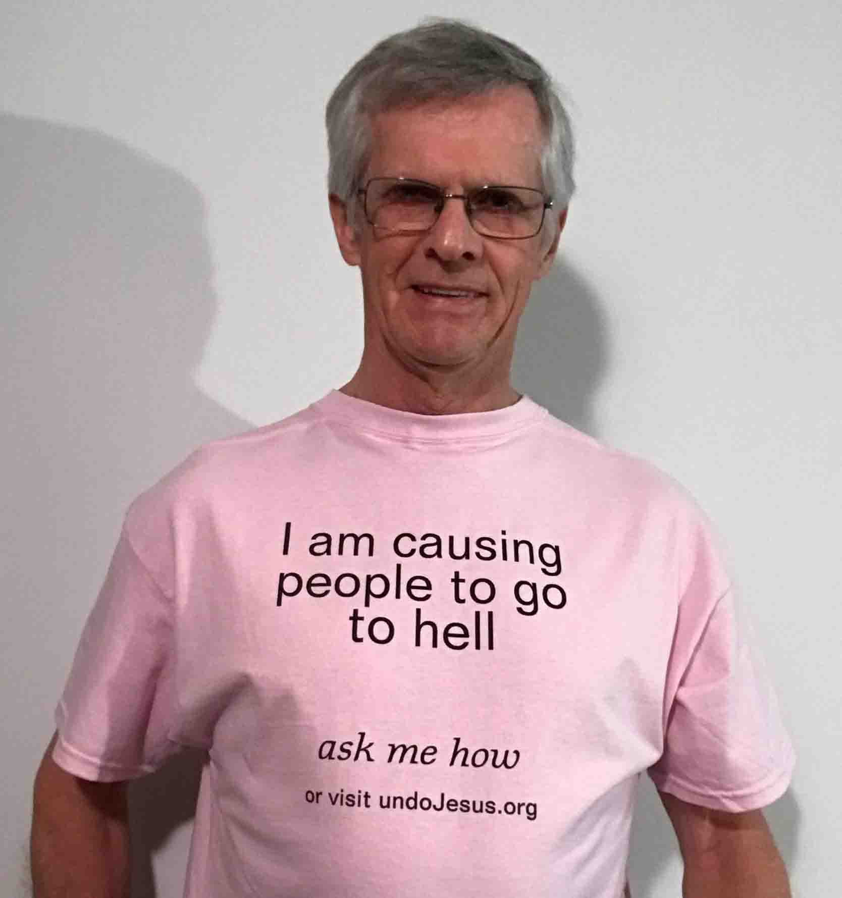 Darwin Bedford wearing his shirt that says 'I am causing people to go to hell, ask me how'