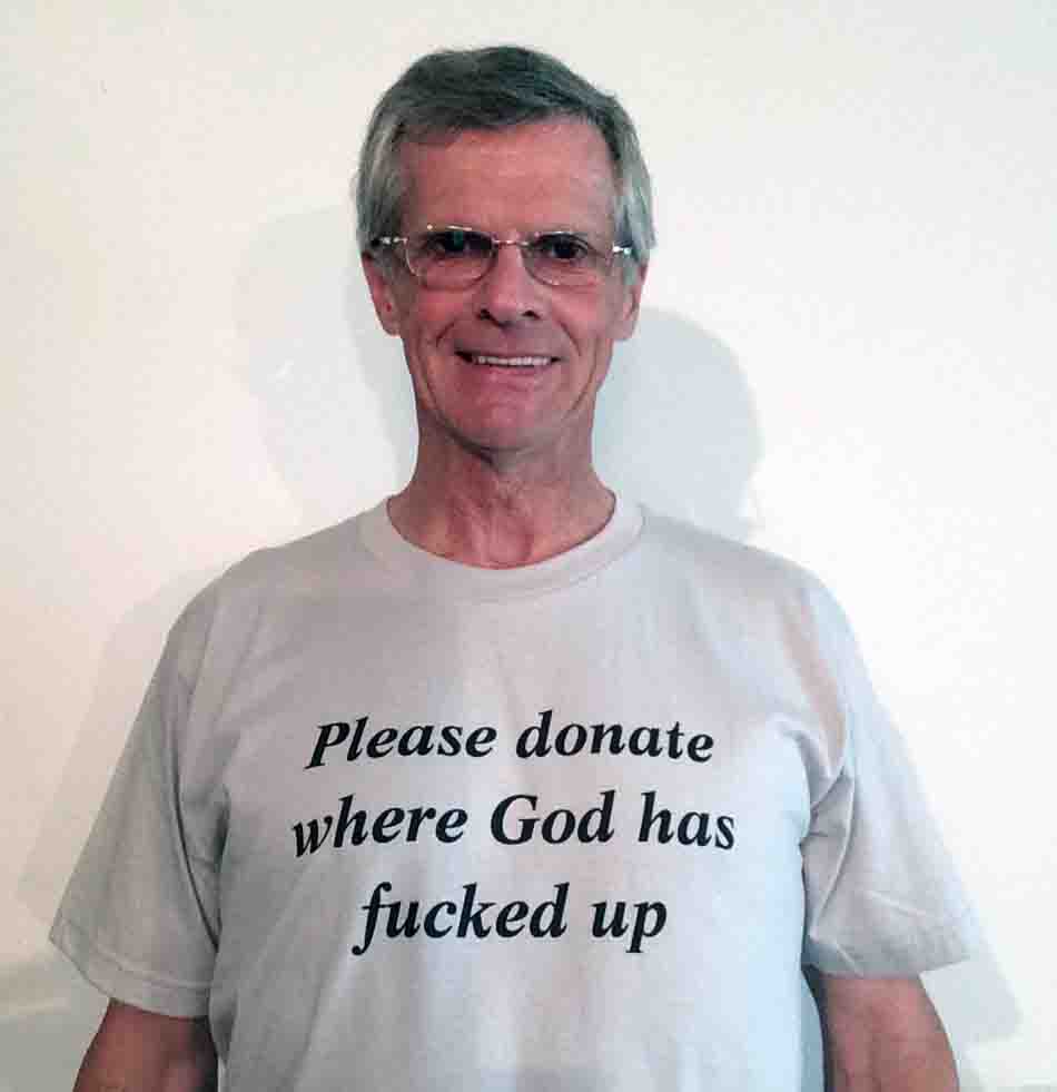 Darwin Bedford wearing his shirt that says 'Please donate where God has fucked-up'